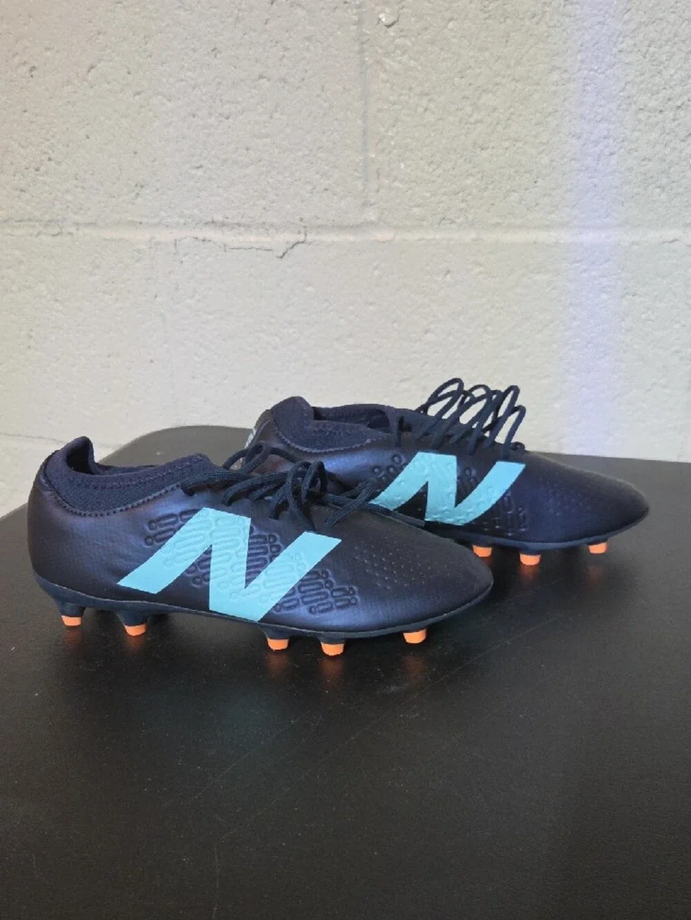 New Balance Men’s Navy Soccer Cleats with Light Blue Logo and Orange Studs